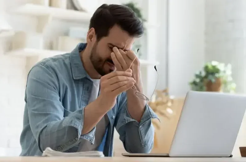 Fatigued adult male needing chiropractic care
