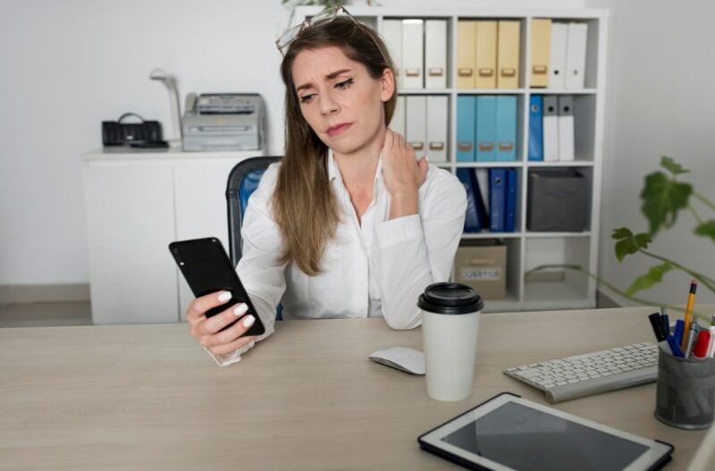 Working woman checking her smartphone